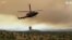 Helicopters Carry Water as Wildfire Rages in Malaga 
