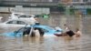 疫情未消又添酷暑洪灾，中国民众正经历三重挑战
