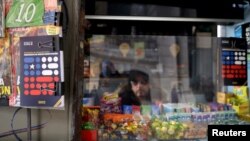 Books of proposed new constitution are displayed at a hawker's street stall at downtown Santiago, Chile July 14, 2022. (REUTERS/Ivan Alvarado)