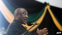 FILE: South Africa President Cyril Ramaphosa addresses delegates at the Olive Convention Centre in Durban, on July 24, 2022.