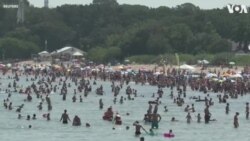Beachgoers Enjoy the Sun as Poland Issues Heat Warnings 