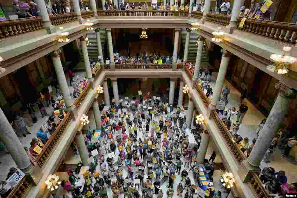 Activists protest in the Indiana Statehouse during a special session debating on banning abortion in Indianapolis, Indiana.
