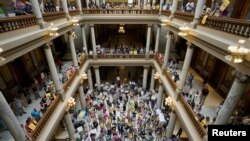 FILE - Activists protest in the Indiana Statehouse during a special session debating on banning abortion, in Indianapolis, Indiana, July 25, 2022.