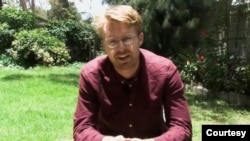 Tom Gardner, a reporter for The Economist, is seen in a video posted by the Pulitzer Center on Crisis Reporting in 2018.
