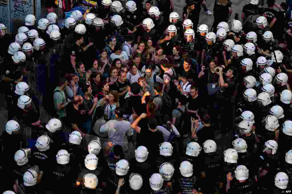 Police officers surround protesters during a rally in the Kadikoy district of Istanbul, Turkey, July 20, 2022,&nbsp;to mark the anniversary of the 2015 suicide attack that took place in the southern Turkish town of Suruc.