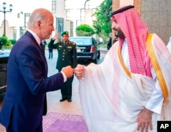 FILE - In this photo released by the Saudi Press Agency, Saudi Crown Prince Mohammed bin Salman greets President Joe Biden with a fist bump after his arrival in Jeddah, Saudi Arabia, July 15, 2022.