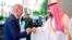 In this photo released by the Saudi Press Agency, Saudi Crown Prince Mohammed bin Salman greets President Joe Biden with a fist bump after his arrival in Jeddah, Saudi Arabia, July 15, 2022.
