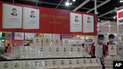 Copies of "Xi Jinping: The Governance of China" are displayed at a booth during the annual book fair in Hong Kong, July 20, 2022.