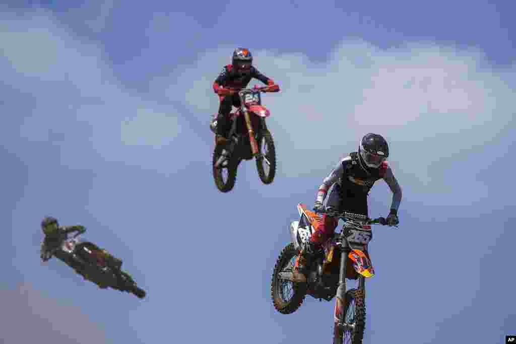 Riders compete during a motocross event of the Maccabiah Games at the Wingate raceway near Netanya, Israel.