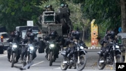 Special force soldiers patrol a road that leads to the parliament in Colombo, Sri Lanka, July 14, 2022.