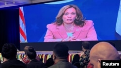 US Vice President Kamala Harris speaks remotely on a video screen during the Pacific Islands Forum at the Grand Pacific Hotel, in Suva, Fiji, July 13, 2022. (REUTERS/Kirsty Needham)