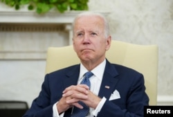 U.S. President Joe Biden listens during his meeting with Mexican President Andres Manuel Lopez Obrador in the Oval Office of the White House in Washington, July 12, 2022.