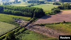 A view of the crash site of an Antonov An-12 cargo plane owned by a Ukrainian company, near Kavala, Greece, July 17, 2022. 