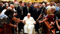 Pope Francis goes to pray by the remains of Saint Francois De Laval after presiding over a Vespers service at the Cathedral-Basilica of Notre Dame de Quebec, July 28, 2022, in Quebec City.