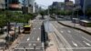 A police officer asks people to find cover during the annual 30-minute drill during which all vehicles are ordered to move to the sides of roads and pedestrians to wait in back streets in Taipei, Taiwan, July 25, 2022