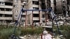 A teddy bear is seen next to a swing, next to buildings destroyed by military strikes, as Russia's invasion of Ukraine continues, in Saltivka, one of the most damaged residential areas of Kharkiv, July 17, 2022. 