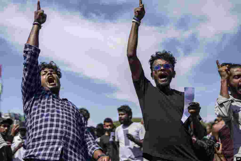 Protesters shout slogans demanding that acting president and Prime Minister Ranil Wickremesinghe resign, in Colombo, Sri Lanka.