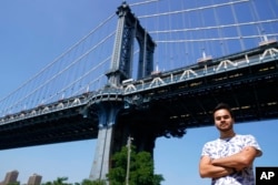 Research engineer Teven Le Scao, who helped create the new artificial intelligence language model called BLOOM, poses for a photo, Monday, July 11, 2022, in New York. (AP Photo/Mary Altaffer)