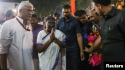 Droupadi Murmu, India's first president from the tribal communities, walks to a welcoming ceremony in New Delhi, India, July 21, 2022. 