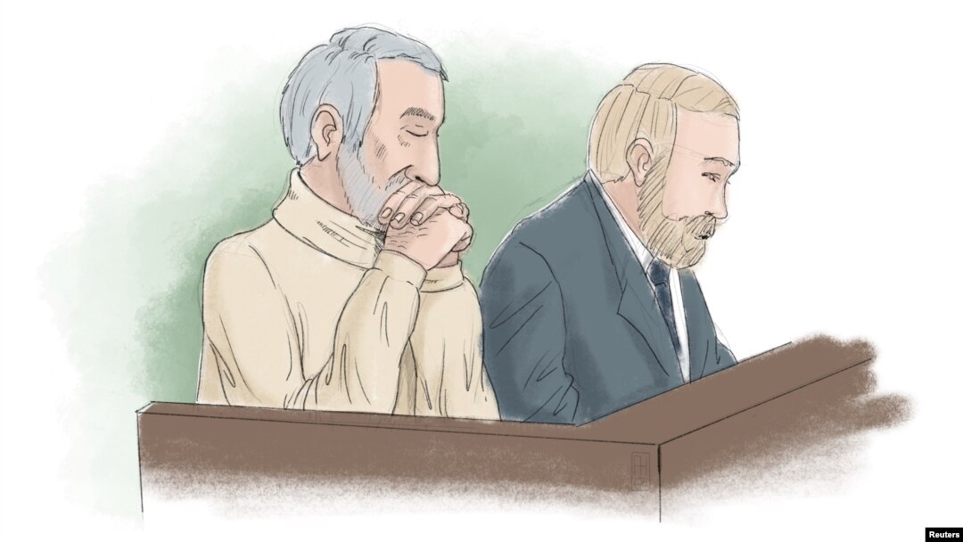 FILE - Hamid Noury, accused of involvement in the massacre of political prisoners in Iran in 1988, sits with attorney Thomas Soderqvist, during his trial, in this sketch from Stockholm District Court, Sweden, Nov. 23, 2021.