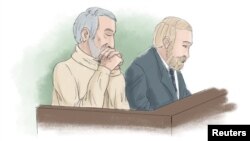 FILE - Hamid Noury, accused of involvement in the massacre of political prisoners in Iran in 1988, sits with attorney Thomas Soderqvist, during his trial, in this sketch from Stockholm District Court, Sweden, Nov. 23, 2021. 