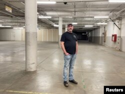 FILE - Chunker Chief Executive Brad Wright poses in the former Sears anchor store at Inland Center Mall in San Bernardino, California, May 18, 2022.