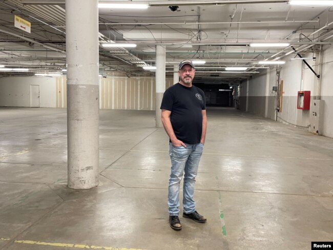 FILE - Chunker Chief Executive Brad Wright poses in the former Sears anchor store at Inland Center Mall in San Bernardino, California, May 18, 2022.