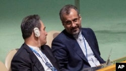 Iran's delegates look at each other while U.S. Secretary of State Antony Blinken addresses the 2022 Nuclear Non-Proliferation Treaty review conference, in the United Nations General Assembly, Aug. 1, 2022. 