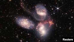 In this image produced by NASA's James Webb Space Telescope, a group of five galaxies that appear close to each other in the sky are shown: two in the middle, one toward the top, one to the upper left, and one toward the bottom. (Image Credit: NASA, ESA,