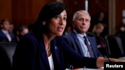 FILE - Dr. Rochelle Walensky, director of the Centers for Disease Control and Prevention (CDC), and top infectious disease expert Dr. Anthony Fauci, testify before the Senate Health, Education, Labor, and Pensions Committee in Washington, D.C., July 20, 2021.