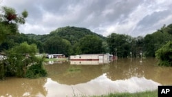 Several mobile homes in Jackson, Ky., are flooded, July 29, 2022. Heavy rains poured into Appalachia last week, displacing hundreds of people.
