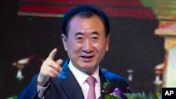 Wang Jianlin, chairman of Wanda Group, gestures as he speaks during a signing ceremony for a strategic partnership between FIBA and Wanda Group in Beijing, Thursday, June 16, 2016. (AP Photo/Andy Wong)