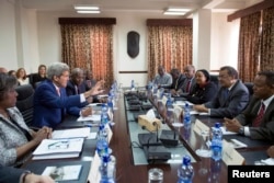 U.S. Secretary of State John Kerry (2nd L) participates in a meeting with Ethiopian Minister of Foreign Affairs Tedros Adhanom (2nd R), Kenyan Foreign Minister Amina Mohamed (3rd R) and Ugandan Foreign Affairs Minister Sam Kutesa (R) in Addis Ababa, May 1.