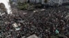 People gather during a protest over President Abdelaziz Bouteflika's decision to postpone elections and extend his fourth term in office, in Algiers, Algeria, March 15, 2019. 