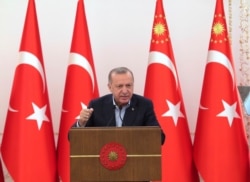 Turkey's President Recep Tayyip Erdogan speaks during an event in Ankara, May 8, 2021. In a speech late Saturday, Erdogan, strongly condemned violence in Jerusalem.