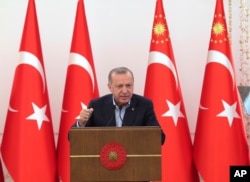 Turkey's President Recep Tayyip Erdogan speaks during an event in Ankara, May 8, 2021. In a speech late Saturday, Erdogan, strongly condemned violence in Jerusalem.
