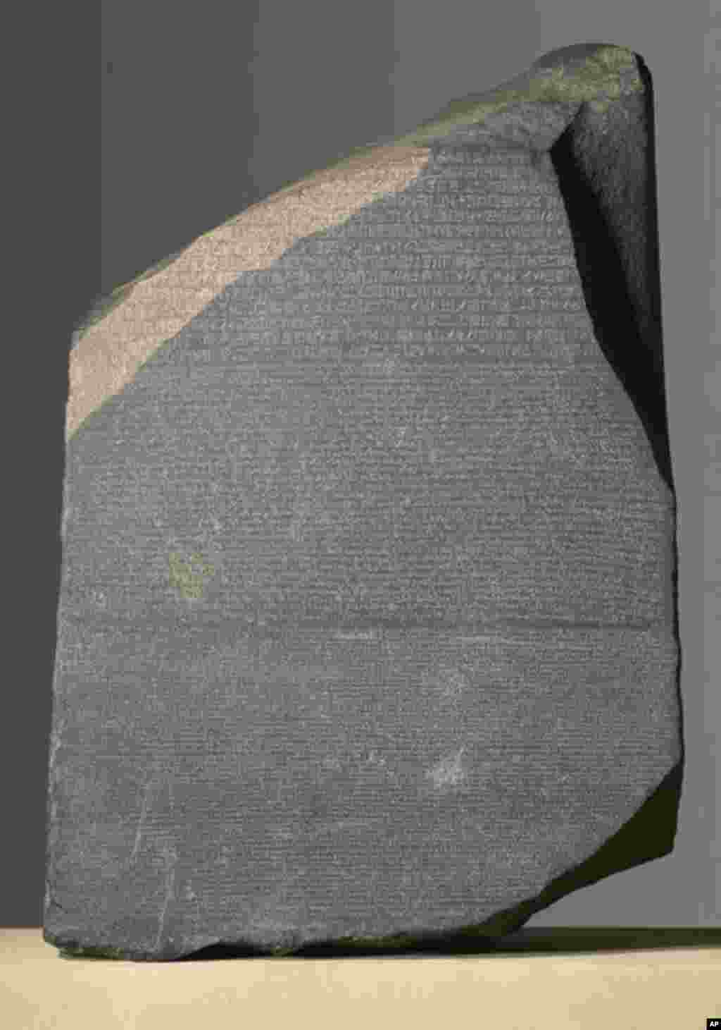 The Rosetta Stone from el-Rashid, Egypt. This artifact, which was created in 196 B.C., unlocked Egyptian hieroglyphics.