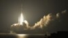 A H-2A rocket carrying four satellites including one from South Korea blasts off from the launching pad at Tanegashima Space Center on the Japanese southwestern island of Tanegashima, about 1,000km (621 miles) southwest of Tokyo, in this photo taken by Ky