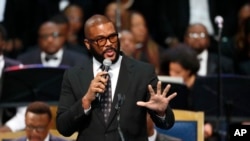 FILE - Tyler Perry speaks during the funeral service for Aretha Franklin at Greater Grace Temple, Aug. 31, 2018, in Detroit.
