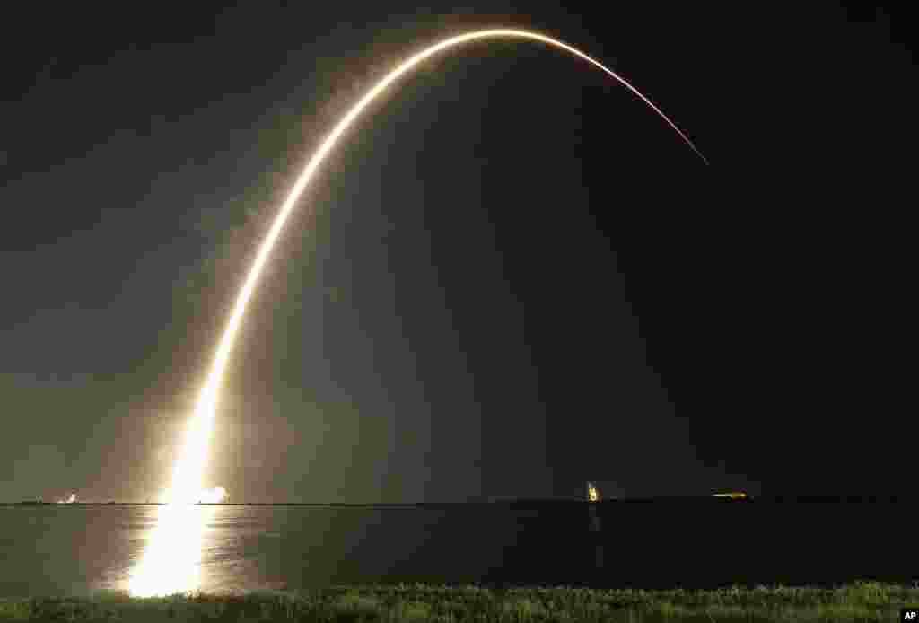 A Falcon 9 SpaceX rocket lifts off from the Cape Canaveral Air Force Station Complex 40 launch pad as seen through a time exposure in Cape Canaveral, Florida.