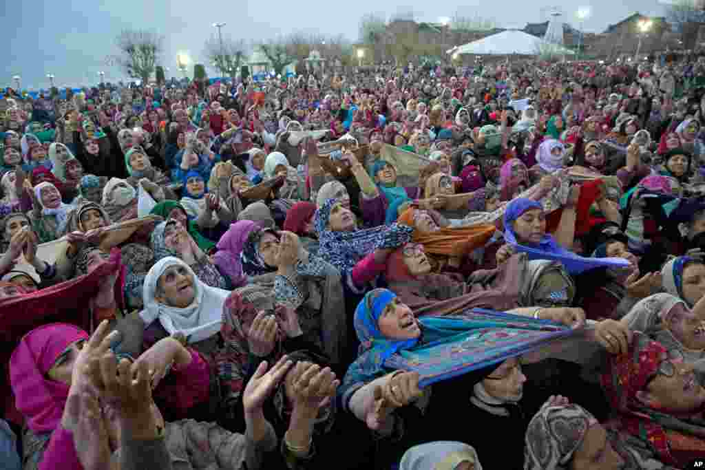 Kashmiri Muslims pray as the head priest displays a relic at the Hazratbal shrine on the occasion of Mehraj-u-Alam, believed to mark the ascension of Prophet Muhammad to heaven, in Srinagar Indian-controlled Kashmir.
