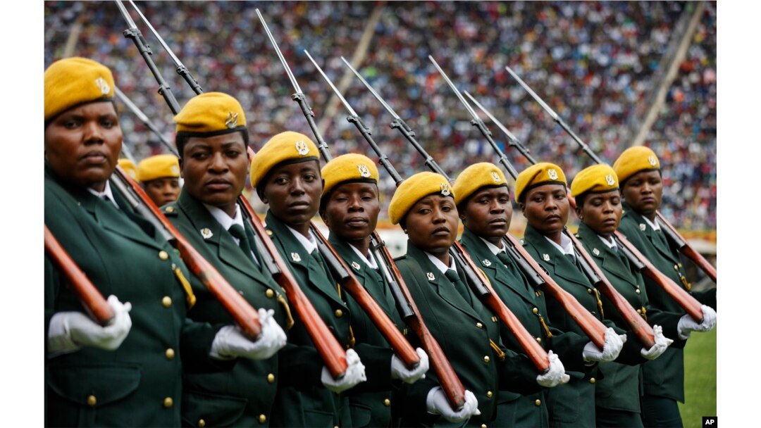 Zimbabwean military turn their heads toward the new president as they parade at the inauguration ceremony of President Emmerson Mnangagwa in the capital Harare, Zimbabwe, Nov. 24, 2017.