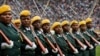 Zimbabwean military turn their heads toward the new president as they parade at the inauguration ceremony of President Emmerson Mnangagwa in the capital Harare, Zimbabwe, Nov. 24, 2017.