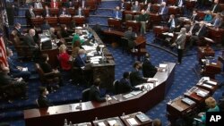 In this image from video, senators vote during the second impeachment trial of former President Donald Trump in the Senate at the U.S. Capitol in Washington, Feb. 13, 2021.