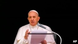 FILE - In this June 6, 2021, photo, Pope Francis speaks from the window of his studio overlooking St. Peter's Square at the Vatican to a crowd of faithful and pilgrims gathered for the Sunday Angelus noon prayer.