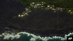 Most of the Kapoho area, including the tide pools, is now covered in fresh lava with few properties still intact as the Kilauea volcano lower east rift zone eruption continues in Pahoa, Hawaii, June 6, 2018.