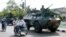 FILE - Indonesian soldiers patrol the streets of Lhokseumawe, June 24, 2003, in the restive province of Aceh, Indonesia. 
