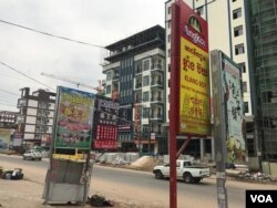 Chinese restaurants and newly constructed buildings are seen on the main road near the family's disputed land in Preah Sihanoukville province, Cambodia, April 3, 2019. (Sun Narin/VOA Khmer)