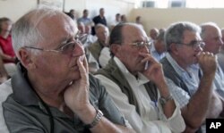 FILE: Zimbabwean farmers attend a meeting of white commercial farmers in capital Harare.