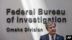 FILE - FBI Director Christopher Wray is pictured at the FBI office in Omaha, Nebraska, Aug. 10, 2022. Wray told lawmakers last month that the bureau's data showed searches for U.S. citizens or their information under FISA Section 702 had dropped 93% from 2021 to 2022. 